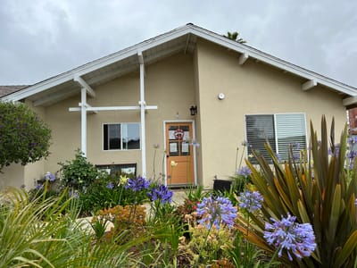 Exterior view of the Casa Salisbury building with flowers