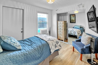 Cozy resident room with a bed and chair