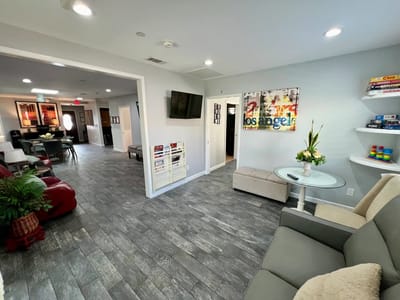 A bright common area in the facility with seating and decorations