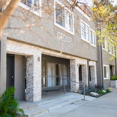 Exterior view of The Cedars Assisted Living facility