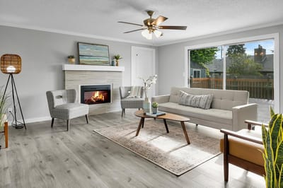 A cozy common area with a fireplace and seating