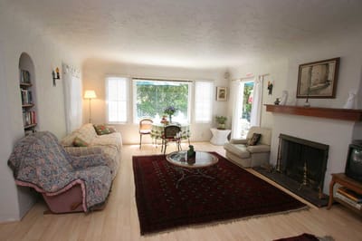 Cozy common area with couches and a fireplace