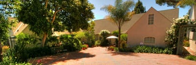Well-maintained outdoor garden with seating area