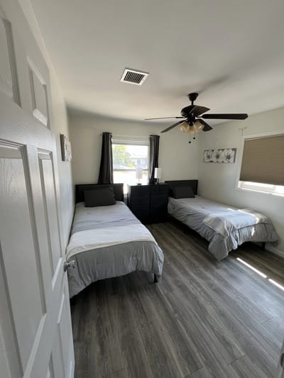 Bright private resident room with two beds