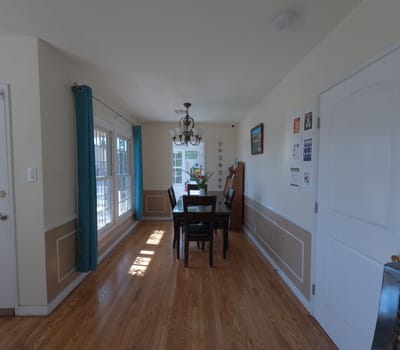 Bright dining area with wooden table and chairs