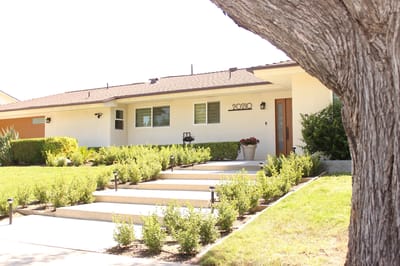 Exterior view of a residence with landscaped entryway