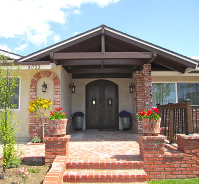 Front entrance of Cheerful Heart Home V with flowers