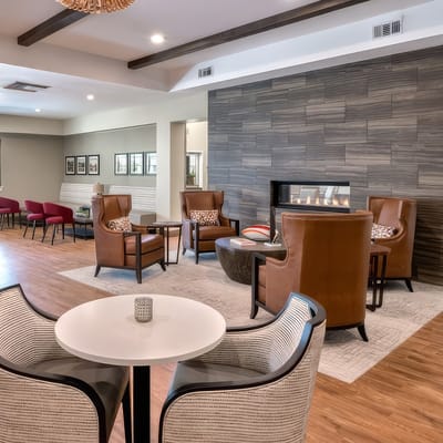 Interior of a common area with seating and a fireplace