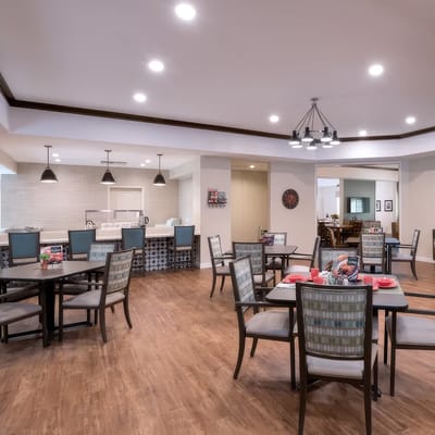 Bright dining room with tables set for meals