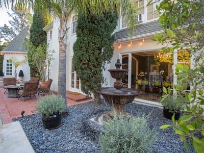 Outdoor space with a fountain and seating area