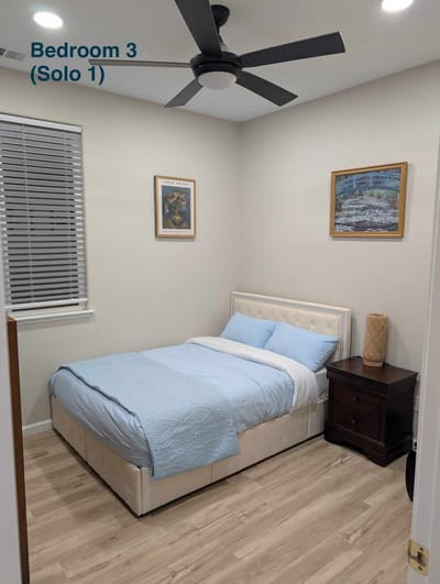 A private bedroom with a bed and decor