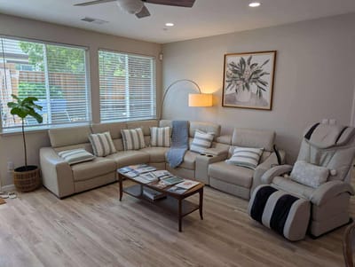 Bright common area with seating and natural light