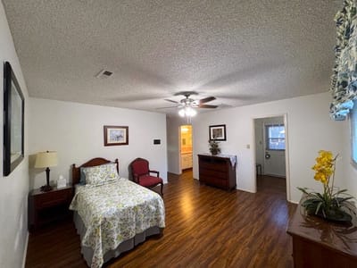 A private resident room with a bed and furniture