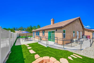 Exterior view of a residence with outdoor seating area