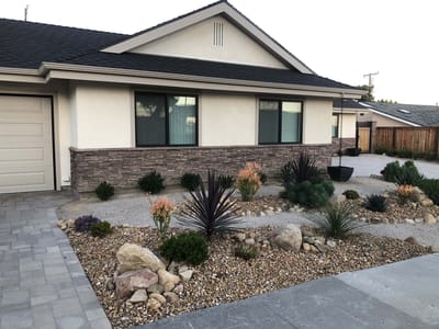 Exterior view of a facility with landscaping.