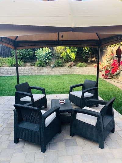 Outdoor seating area with chairs and garden