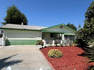 Exterior view of a senior living facility with landscaping