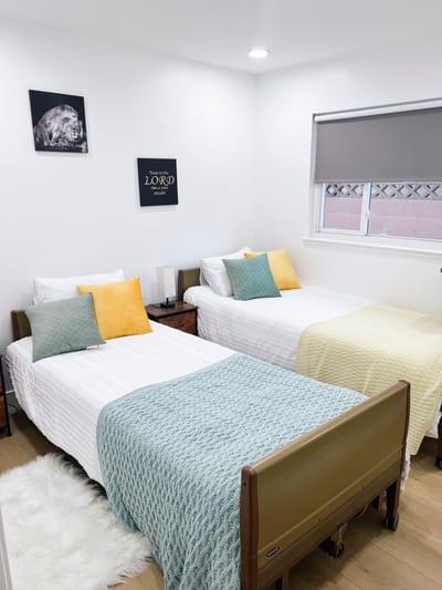 Cozy shared bedroom with two beds and decor