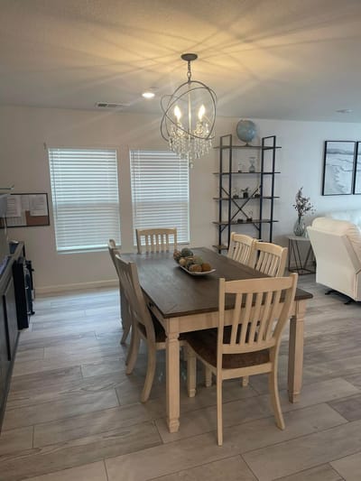 Bright dining area with a large table and chairs