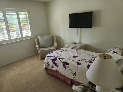 Cozy resident room with a bed and chair