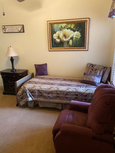 Cozy resident room with bed and seating area