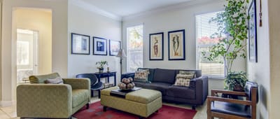 Cozy common area with seating and artwork
