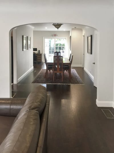 Interior view of a dining area with wooden table and chairs