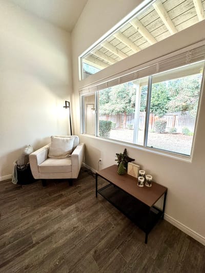 Cozy indoor seating area with a view of the garden