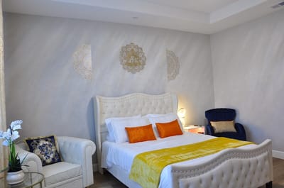 Bright and well-decorated resident room with a bed