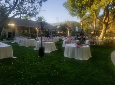Outdoor event setup with tables and decorations