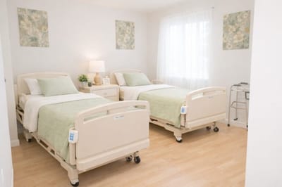 A well-furnished shared resident room with two beds