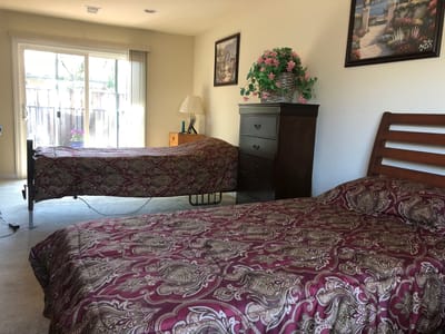 A cozy shared bedroom with two beds and decorations