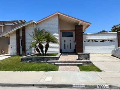 Exterior view of a residential building with landscaping