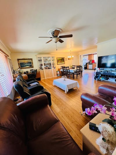Bright common area with seating and dining table