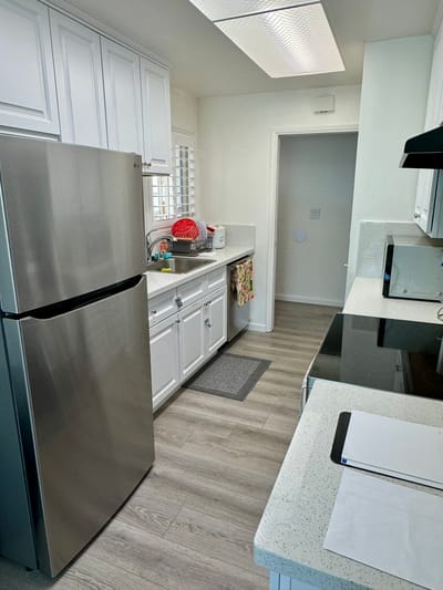 Clean kitchen area with modern appliances