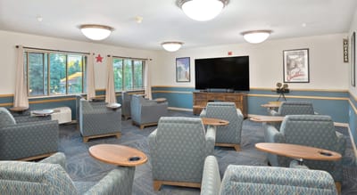 Cozy common area with seating and TV
