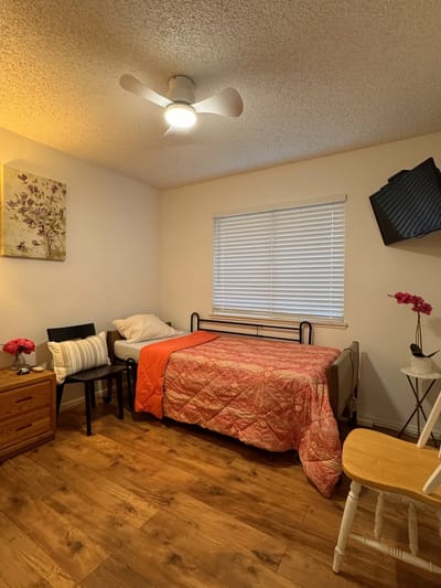 Cozy resident room with a bed and seating