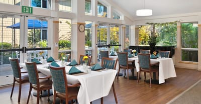 Well-set dining room with tables and chairs