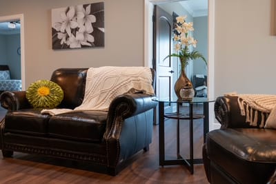 Cozy seating area with a decorative flower vase