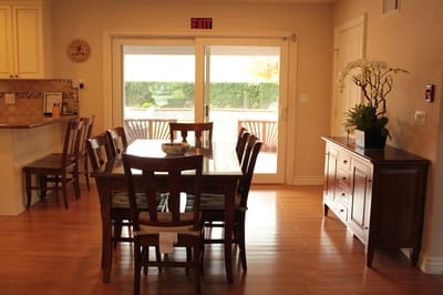 Bright dining area with wooden table and chairs
