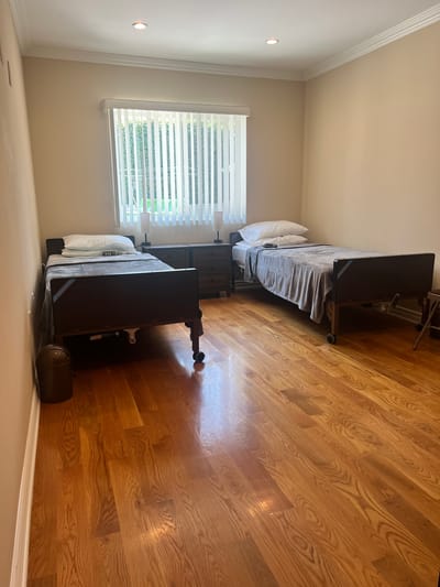 Bright private resident room with two beds