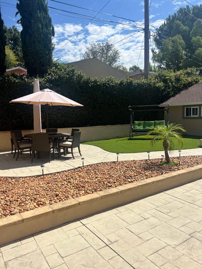 Outdoor space with seating and a swing