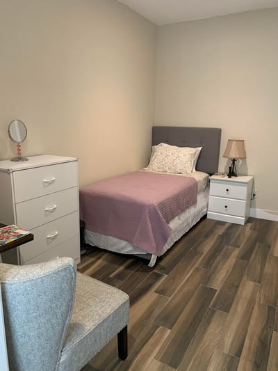 Cozy resident room with a bed and furniture