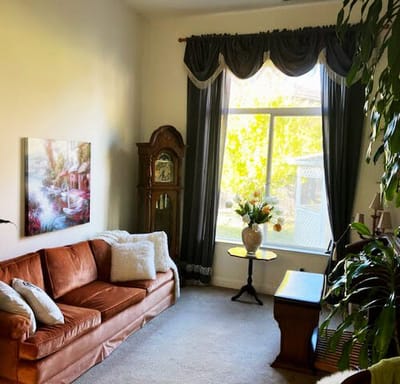 Cozy common area with a sofa and natural light