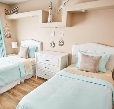 Brightly decorated resident room with twin beds