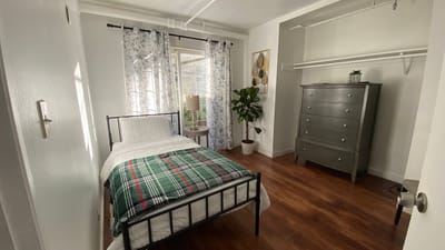 Cozy private room with bed and window