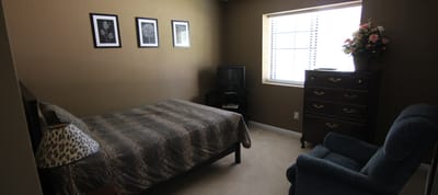 Cozy resident room with a bed and decor