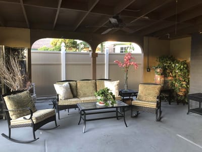 Outdoor seating area with plants and decor