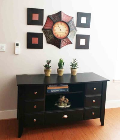 Decorative interior space with clock and plants