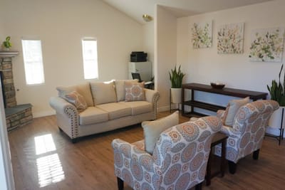 Bright common area with comfortable seating and artwork